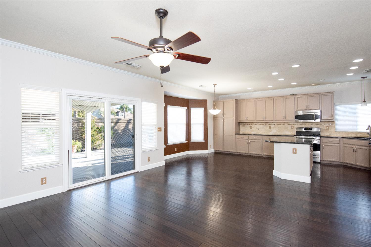 3601 Chant Drive Modesto, CA 95355 - Photo 10 of 23 a view of kitchen with refrigerator stove and wooden floor