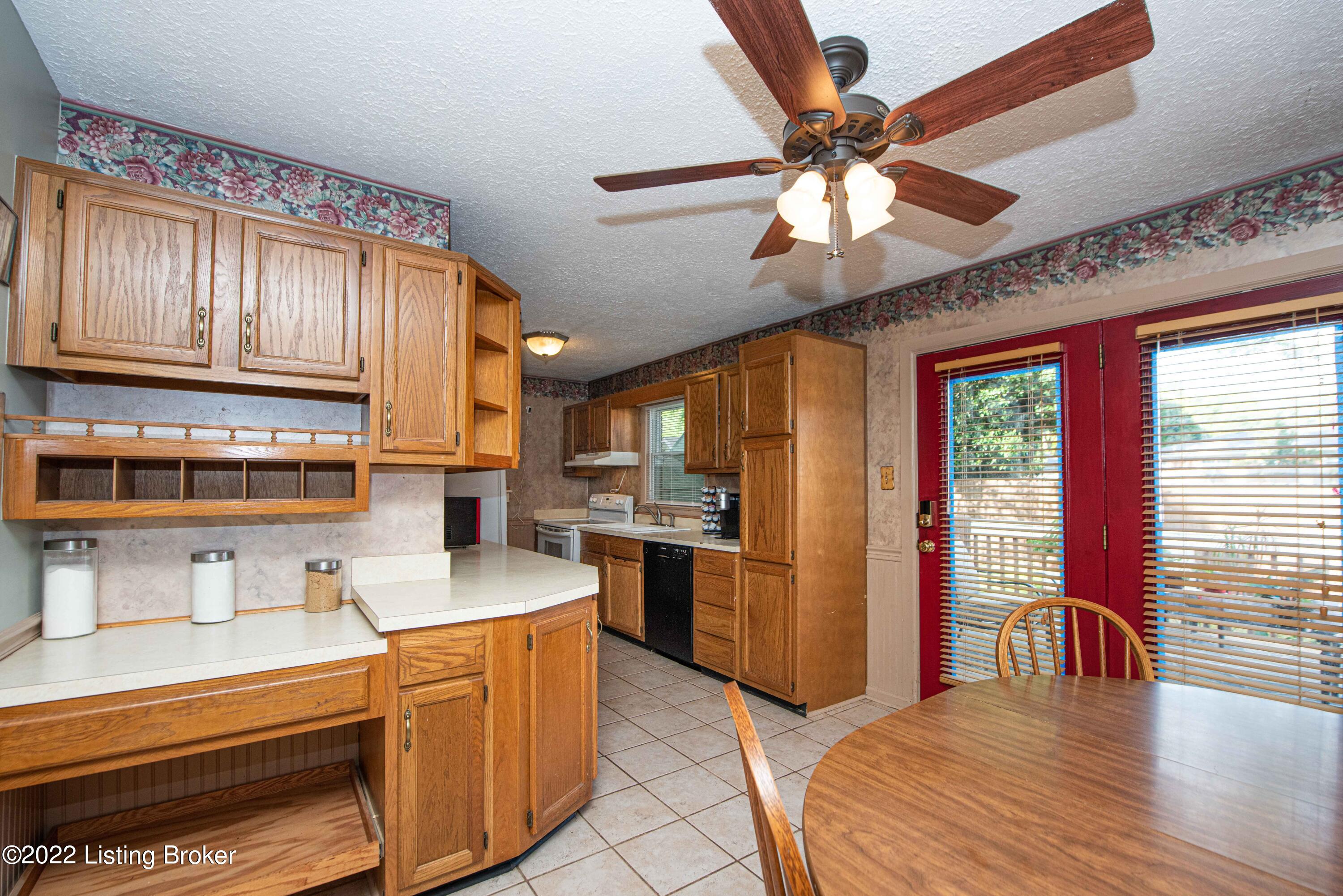 6348 Hunters Grove Road Louisville, KY 40216 - Photo 8 of 44 Eat in kitchen with oak cabinets and ceramic tile floor