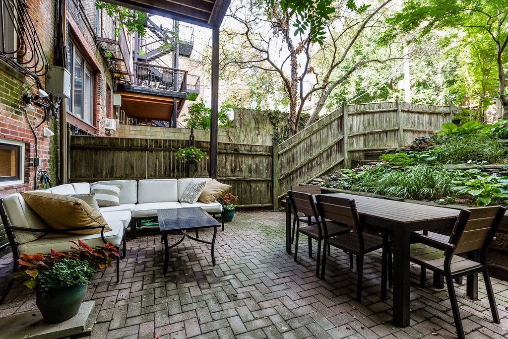 33 Worcester Street, Unit 1 Boston, MA 02118 - Photo 15 of 23 a backyard of a house with table and chairs
