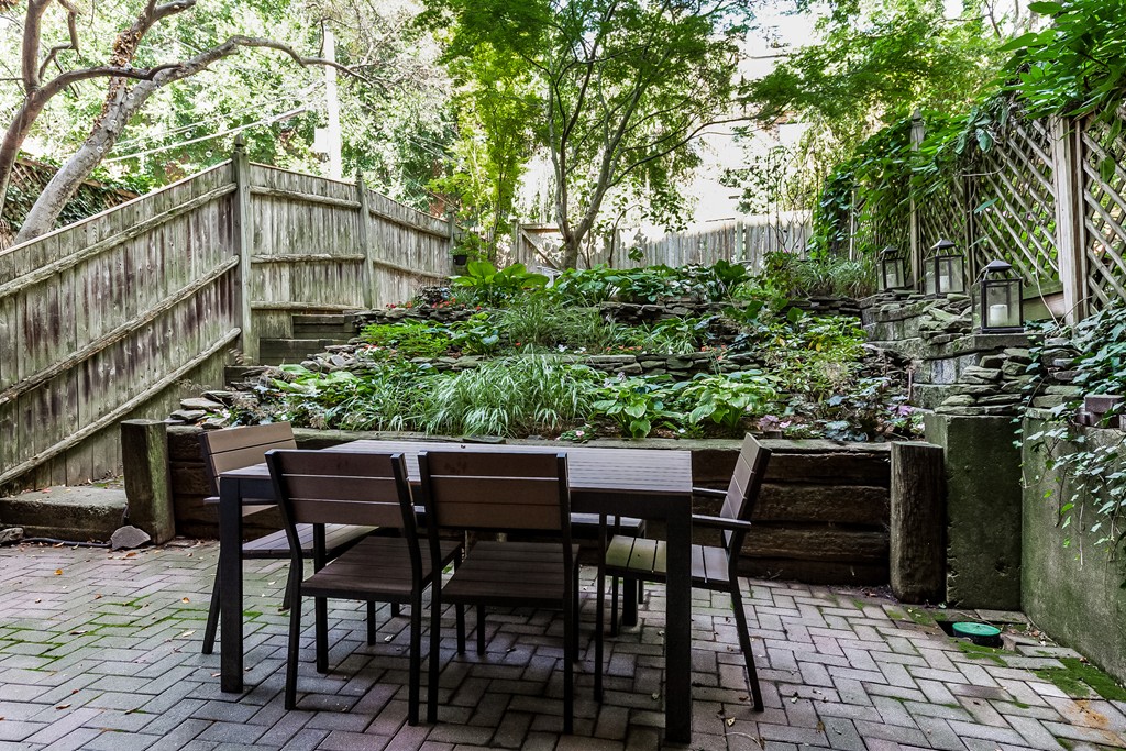 33 Worcester Street, Unit 1 Boston, MA 02118 - Photo 16 of 23 a backyard of a house with table and chairs