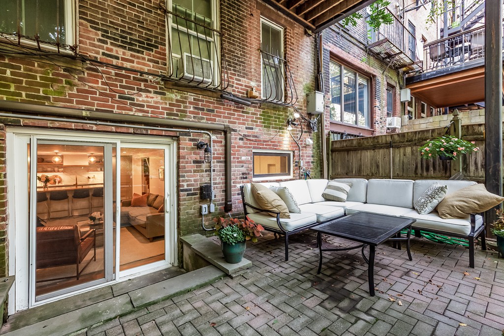 33 Worcester Street, Unit 1 Boston, MA 02118 - Photo 18 of 23 a backyard of a house with outdoor seating