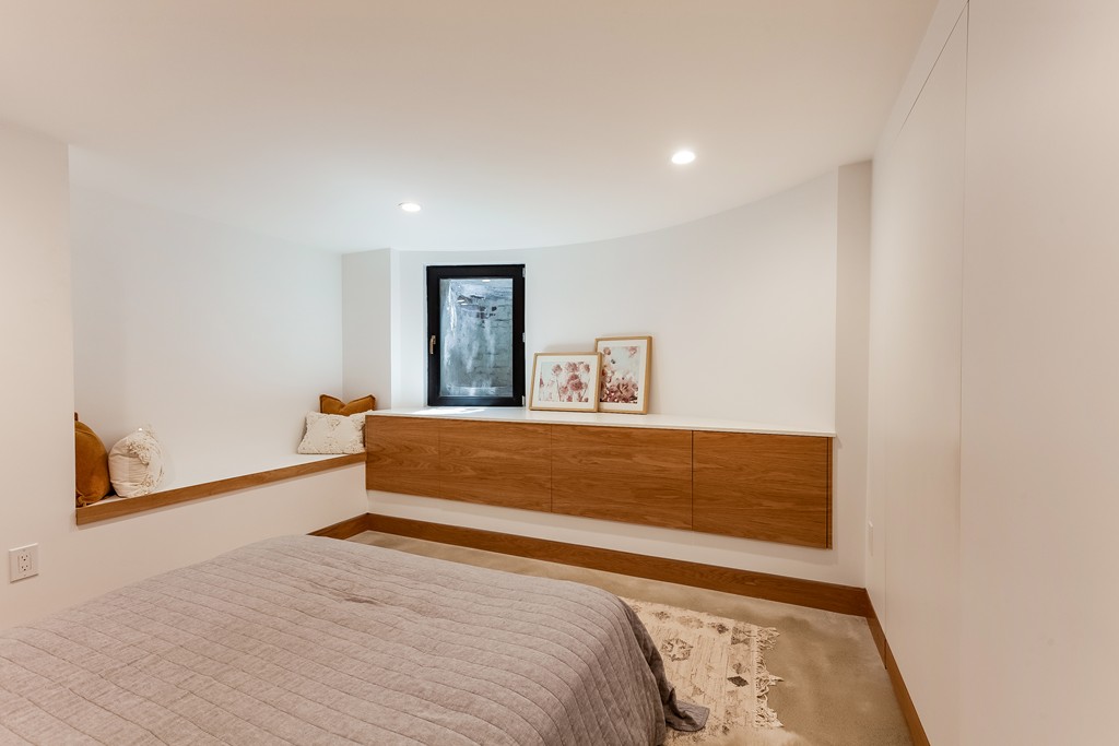 33 Worcester Street, Unit 1 Boston, MA 02118 - Photo 8 of 23 a bedroom with a bed and a window