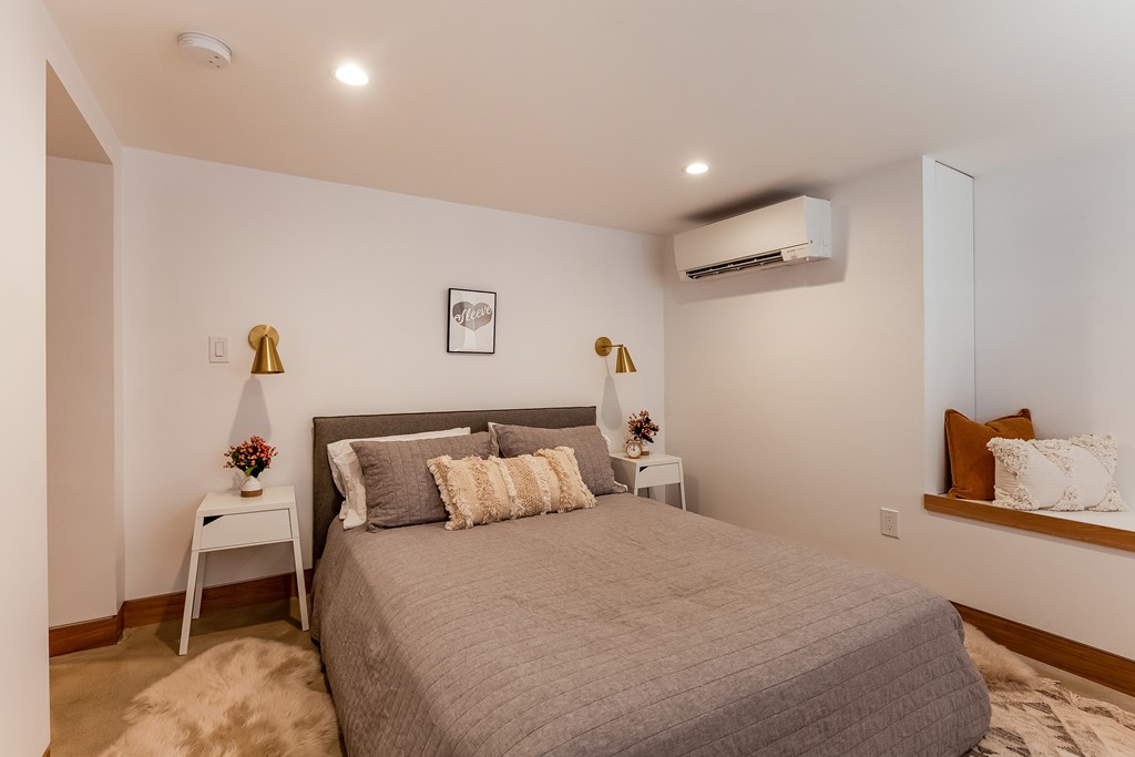 33 Worcester Street, Unit 1 Boston, MA 02118 - Photo 9 of 23 a bedroom with a bed and a table