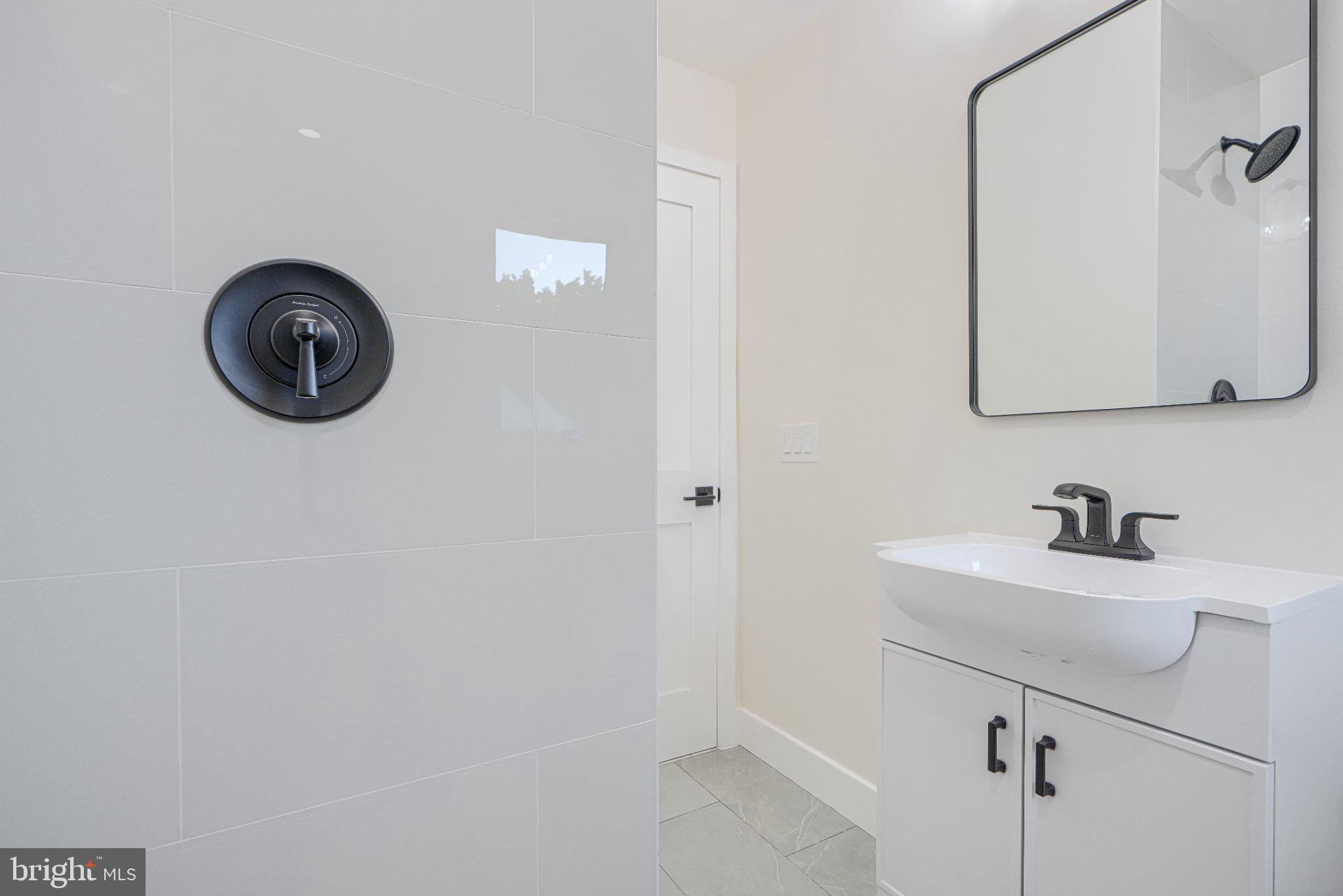 103 Stoneleigh Road Bel Air, MD 21014 - Photo 35 of 45 Sleek modern bathroom with elegant fixtures.