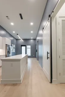 a bedroom with furniture and a flat screen tv