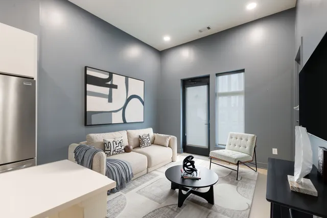 a view of kitchen with stainless steel appliances kitchen island a refrigerator sink and cabinets