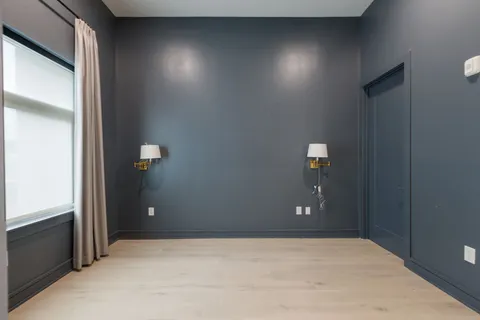 a bathroom with a toilet a sink and shower