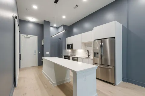 a view of a kitchen with a sink