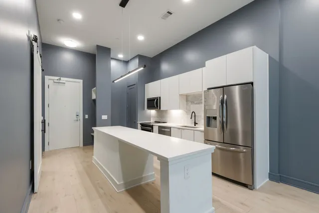 a view of a kitchen with a sink