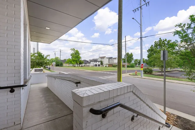 a view of a building with a yard