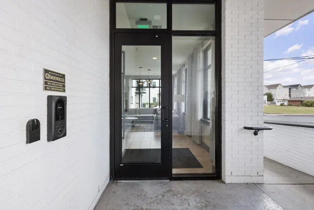 a view of a swimming pool with a yard