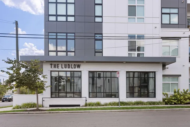 a view of a chairs and table in a balcony
