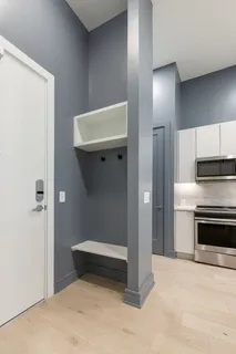 a kitchen with a sink stainless steel appliances and cabinets