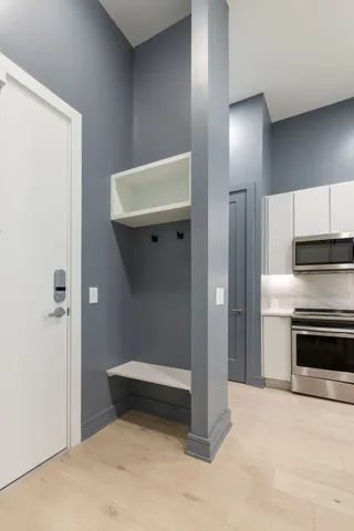 a kitchen with a sink stainless steel appliances and cabinets