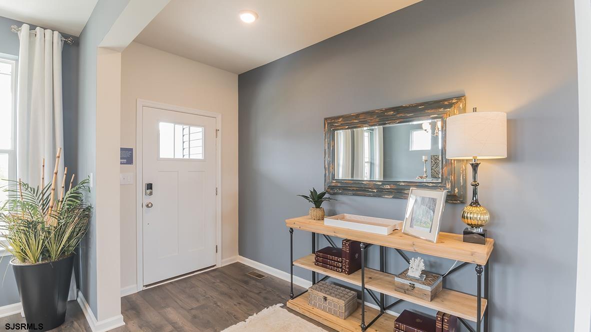 147 Leeds Point Road Galloway Township, NJ 08205 - Photo 3 of 24 a room with furniture and a potted plant