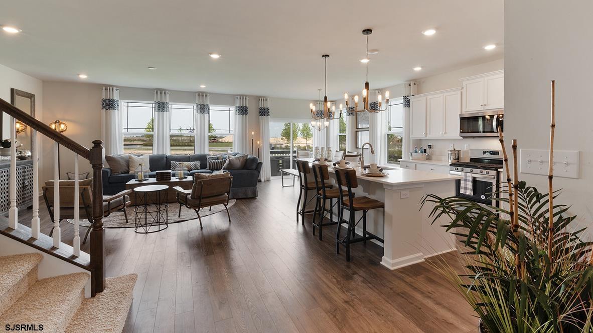 147 Leeds Point Road Galloway Township, NJ 08205 - Photo 10 of 24 a large kitchen with stainless steel appliances a large center island attached withe living room