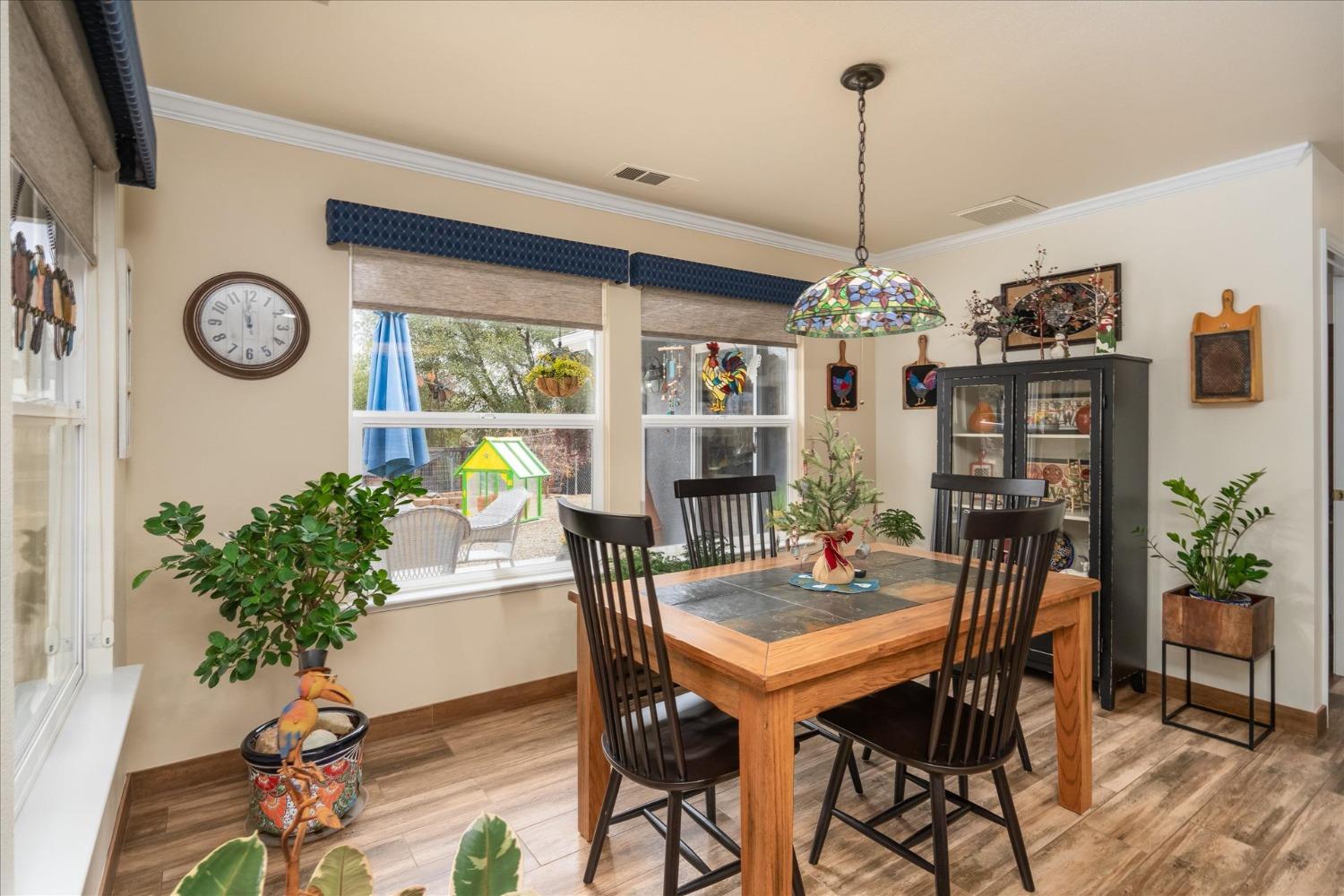 33655 River Knolls Road Coarsegold, CA 93614 - Photo 17 of 55 a view of a dining room with furniture window and wooden floor