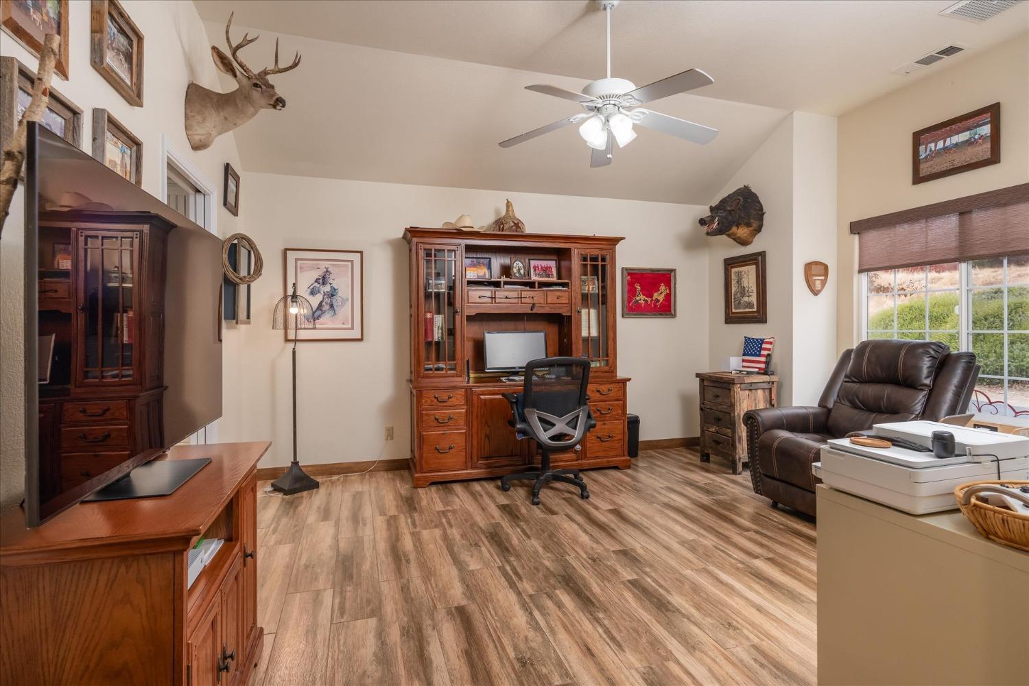 33655 River Knolls Road Coarsegold, CA 93614 - Photo 18 of 55 a view of a livingroom with furniture and a flat screen tv