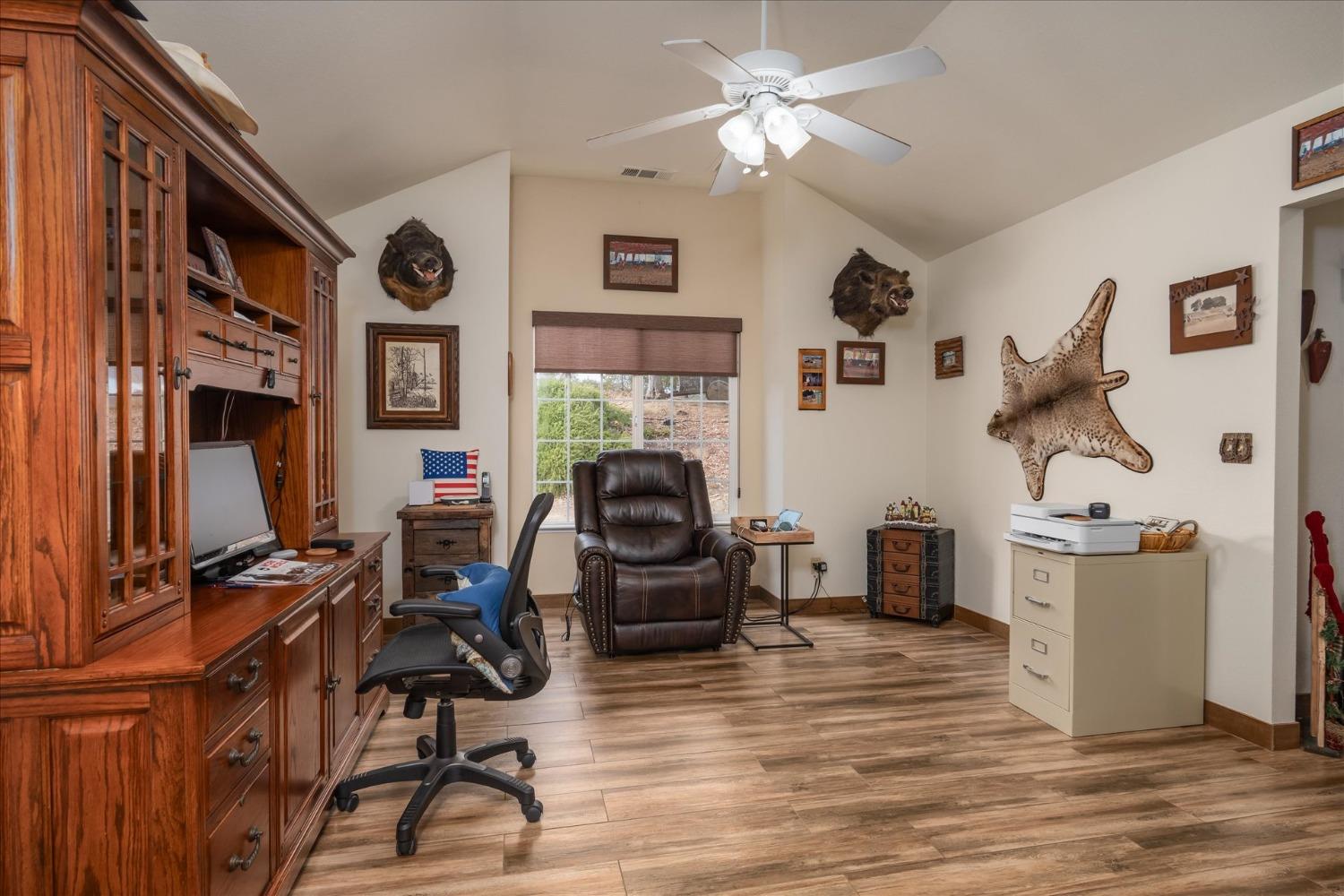 33655 River Knolls Road Coarsegold, CA 93614 - Photo 19 of 55 a work room with furniture and a fireplace