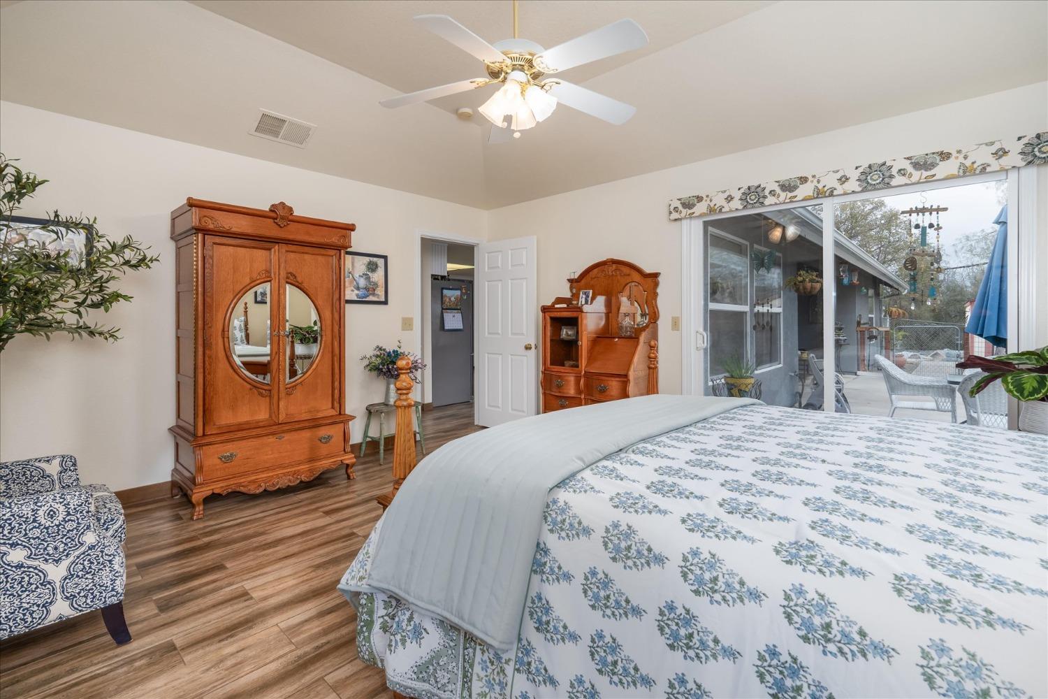 33655 River Knolls Road Coarsegold, CA 93614 - Photo 23 of 55 a bedroom with bed and wooden floor