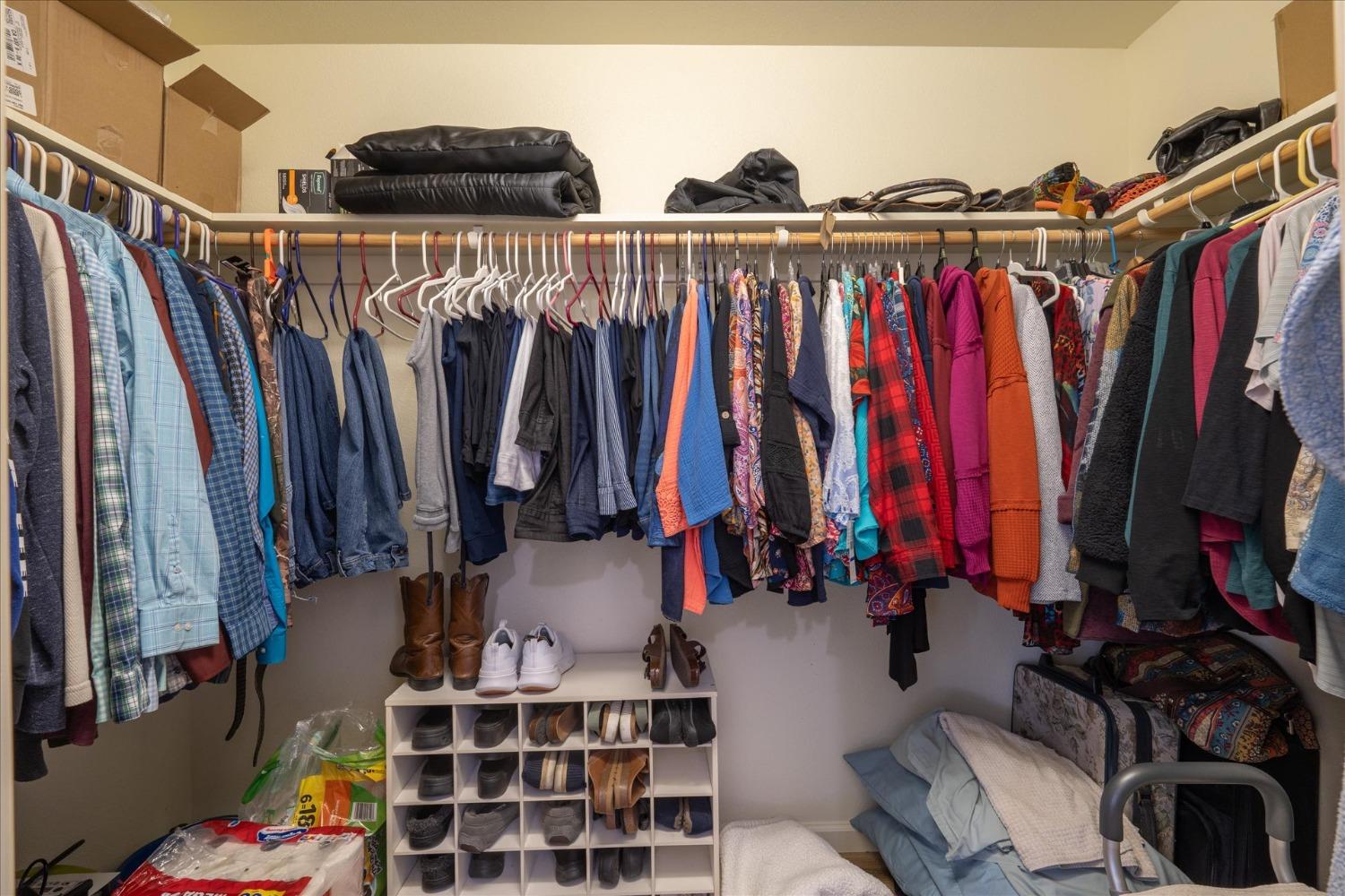 33655 River Knolls Road Coarsegold, CA 93614 - Photo 26 of 55 a view of walk in closet with clothes and shoes