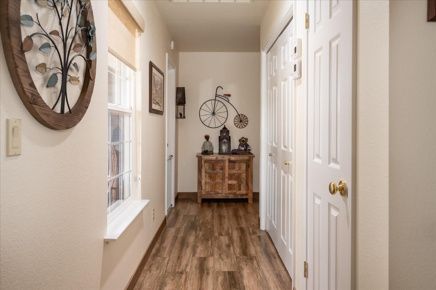 33655 River Knolls Road Coarsegold, CA 93614 - Photo 27 of 55 a view of a hallway with wooden floor and entryway