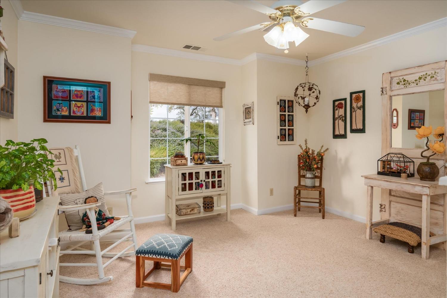 33655 River Knolls Road Coarsegold, CA 93614 - Photo 28 of 55 a living room with furniture a chandelier and a window