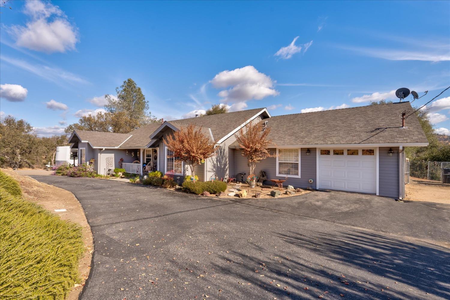33655 River Knolls Road Coarsegold, CA 93614 - Photo 3 of 55 a view of a house with a outdoor space