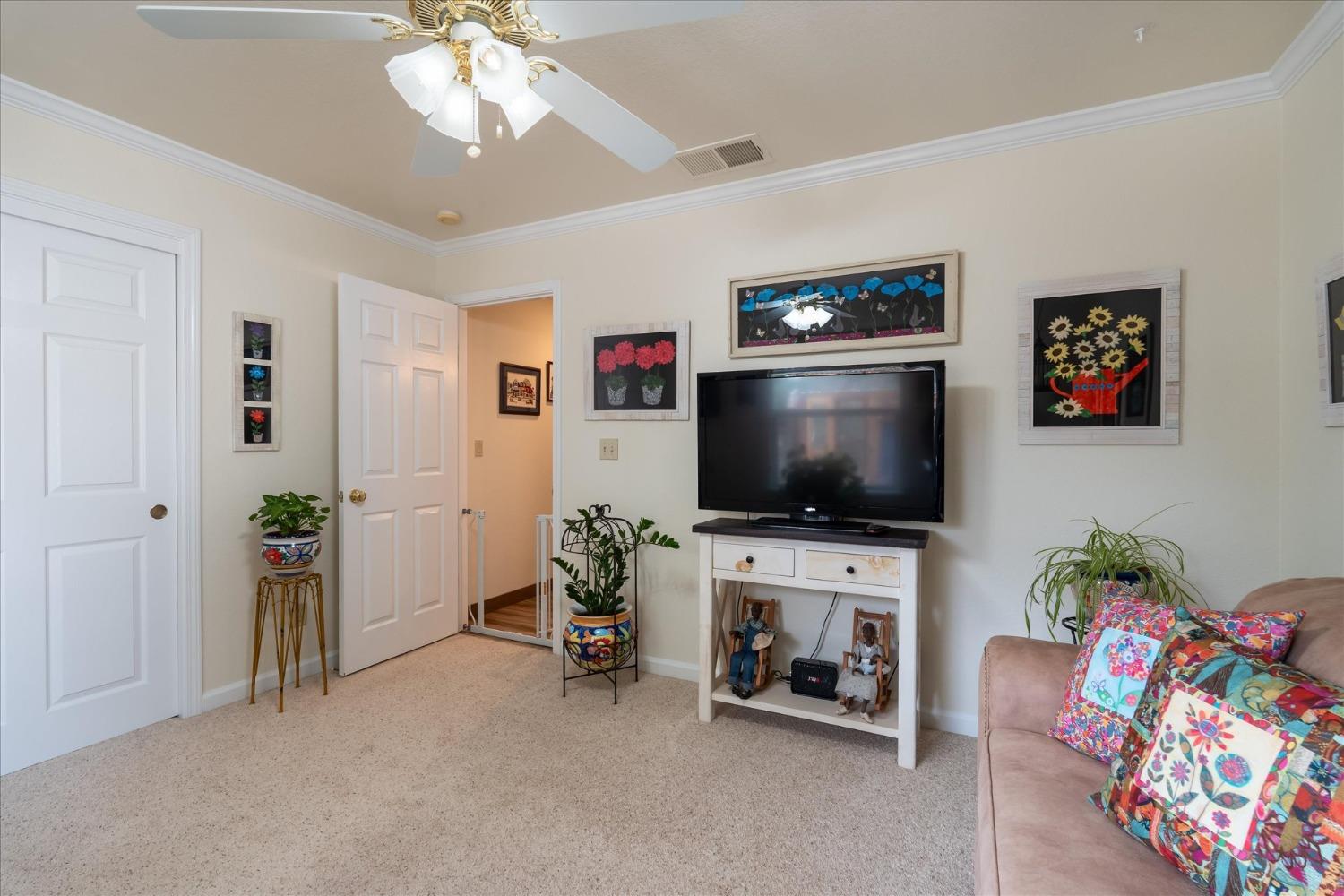 33655 River Knolls Road Coarsegold, CA 93614 - Photo 34 of 55 a living room with furniture and a flat screen tv