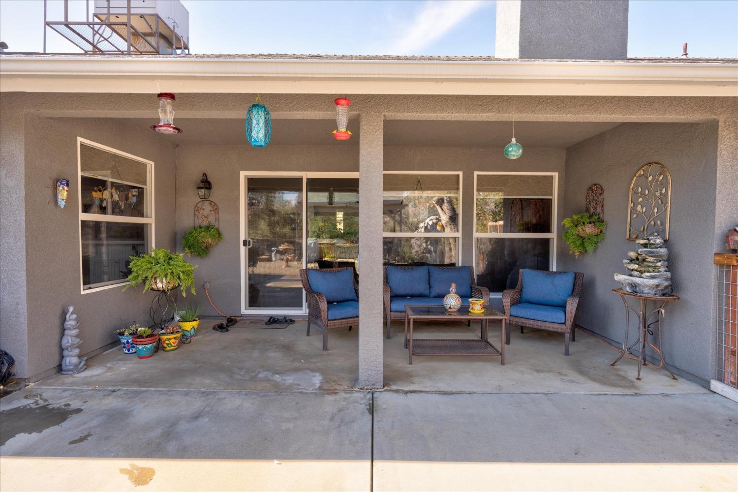 33655 River Knolls Road Coarsegold, CA 93614 - Photo 37 of 55 a living room with furniture and potted plants