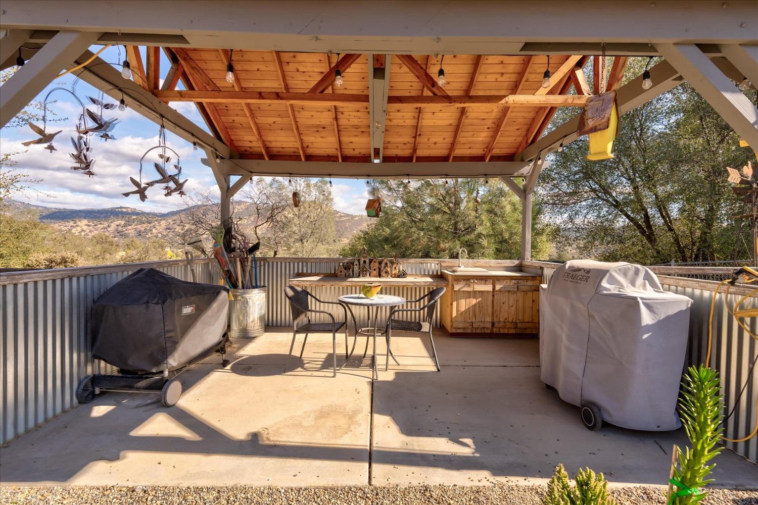 33655 River Knolls Road Coarsegold, CA 93614 - Photo 39 of 55 a view of a chairs and table in the patio