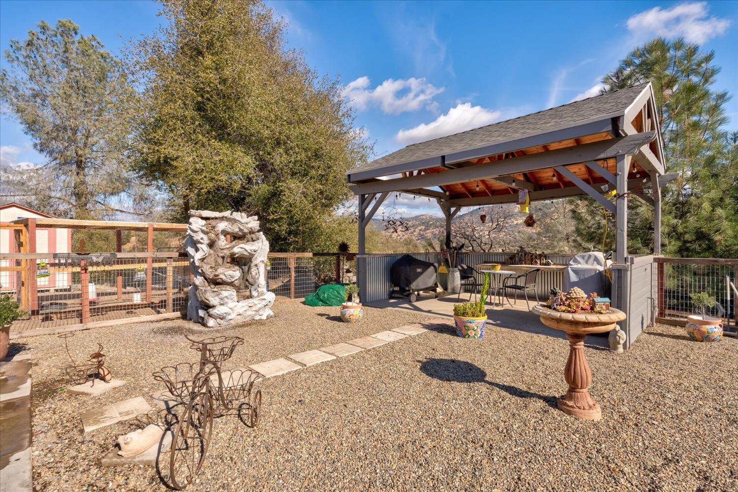 33655 River Knolls Road Coarsegold, CA 93614 - Photo 40 of 55 a view of a couch with wooden fence