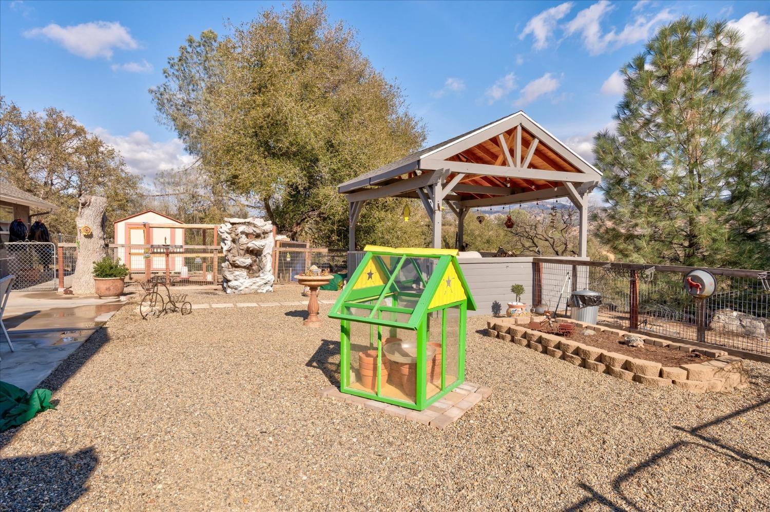 33655 River Knolls Road Coarsegold, CA 93614 - Photo 41 of 55 a street view with tall buildings and a park