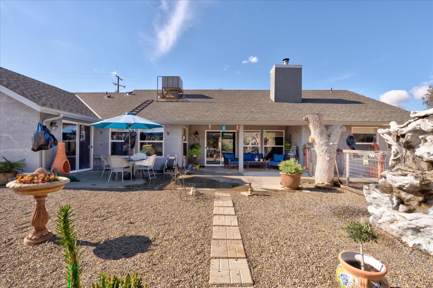 33655 River Knolls Road Coarsegold, CA 93614 - Photo 43 of 55 a view of a building with sitting area and furniture