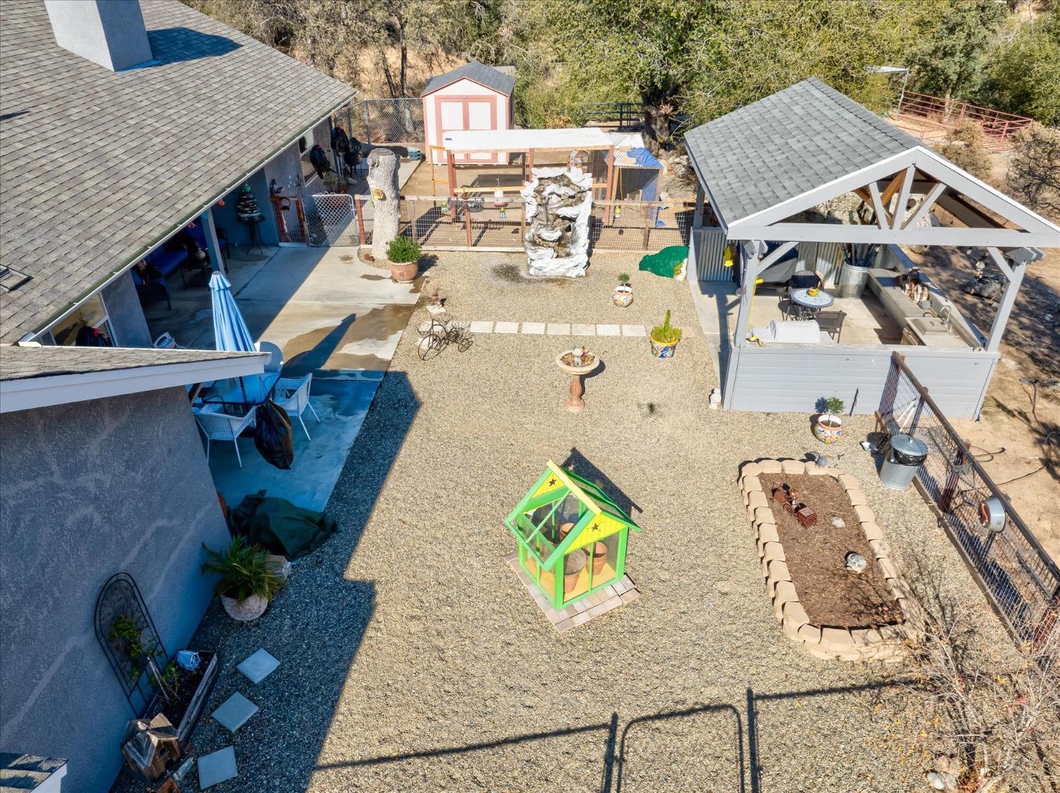 33655 River Knolls Road Coarsegold, CA 93614 - Photo 48 of 55 an aerial view of a house with swimming pool