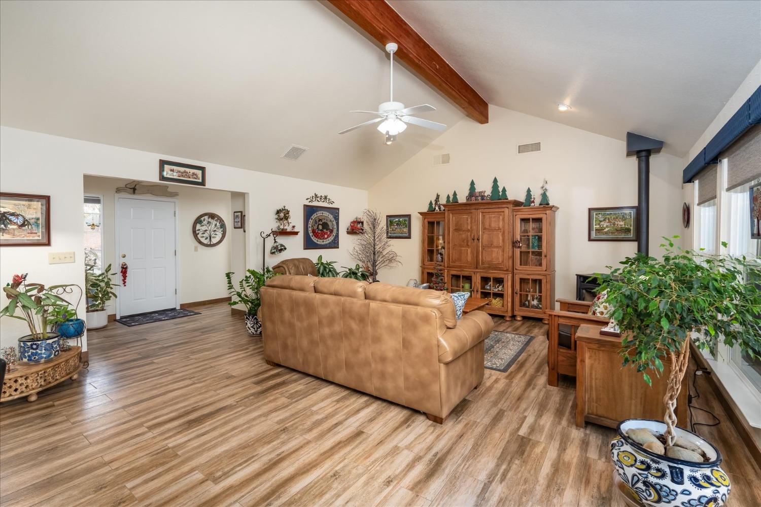 33655 River Knolls Road Coarsegold, CA 93614 - Photo 10 of 55 a living room with furniture and a flat screen tv