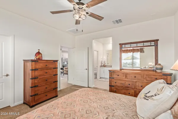 a bed room with a bed and a dresser