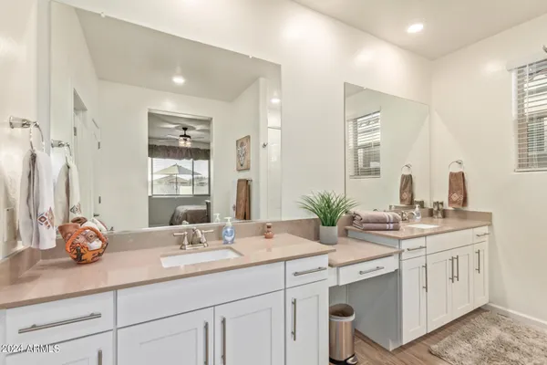 a bathroom with a sink double vanity and a mirror