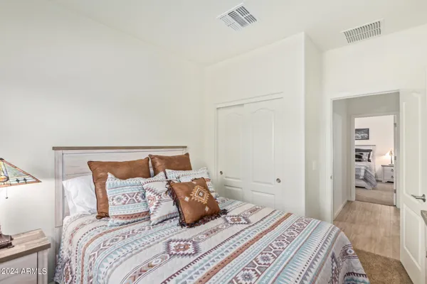 a bedroom with a bed and walk in closet