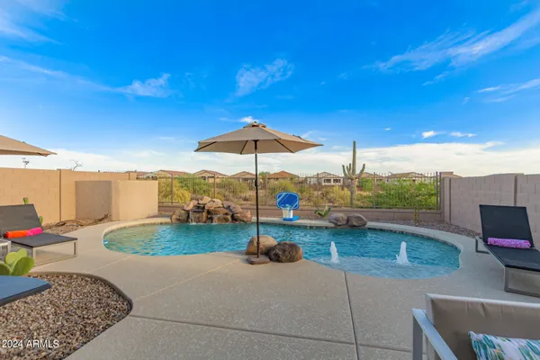 a view of a backyard with a patio