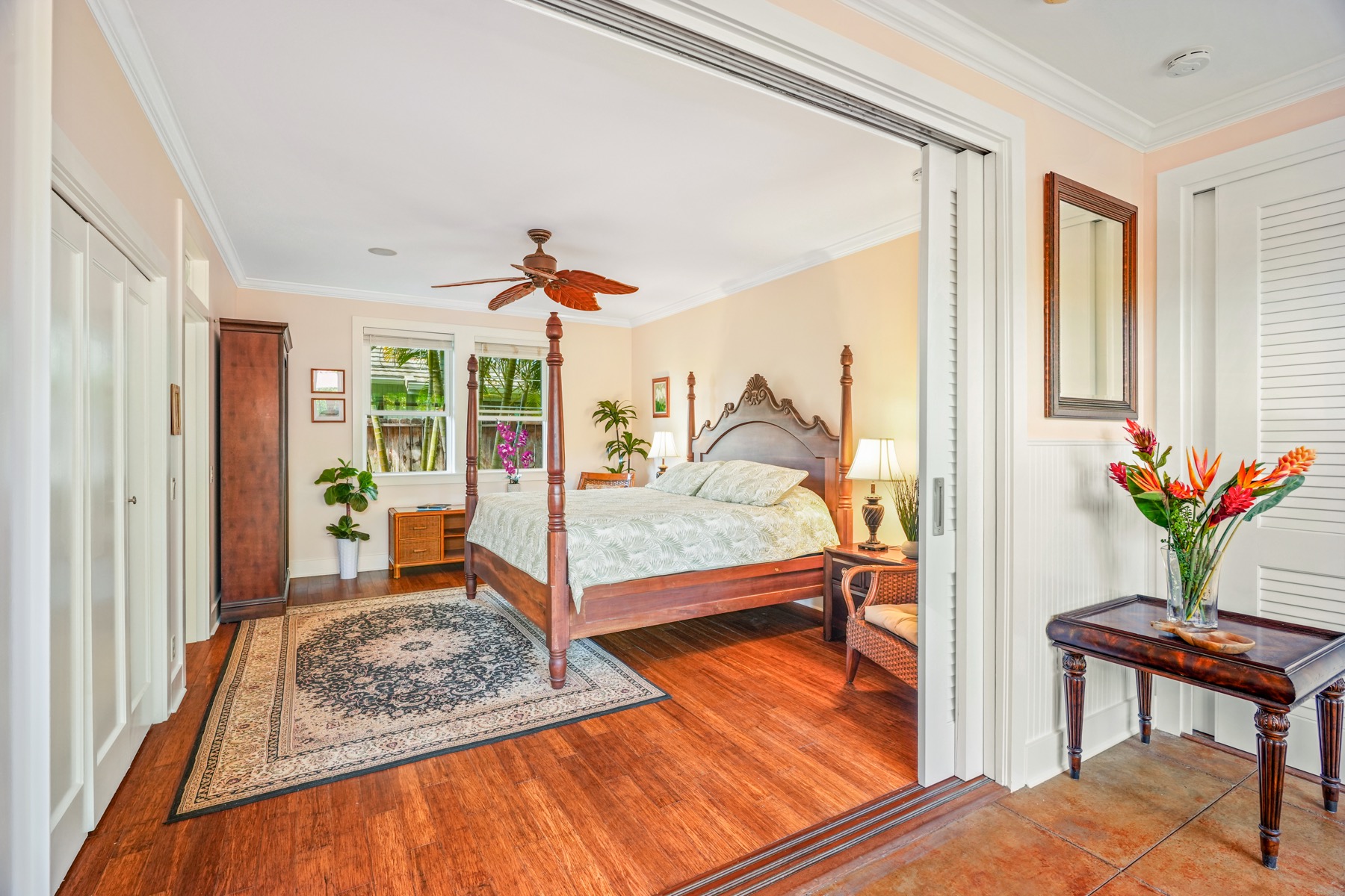 1730 Keleka Road Koloa, HI 96756 - Photo 17 of 29 a bedroom with furniture and a potted plant