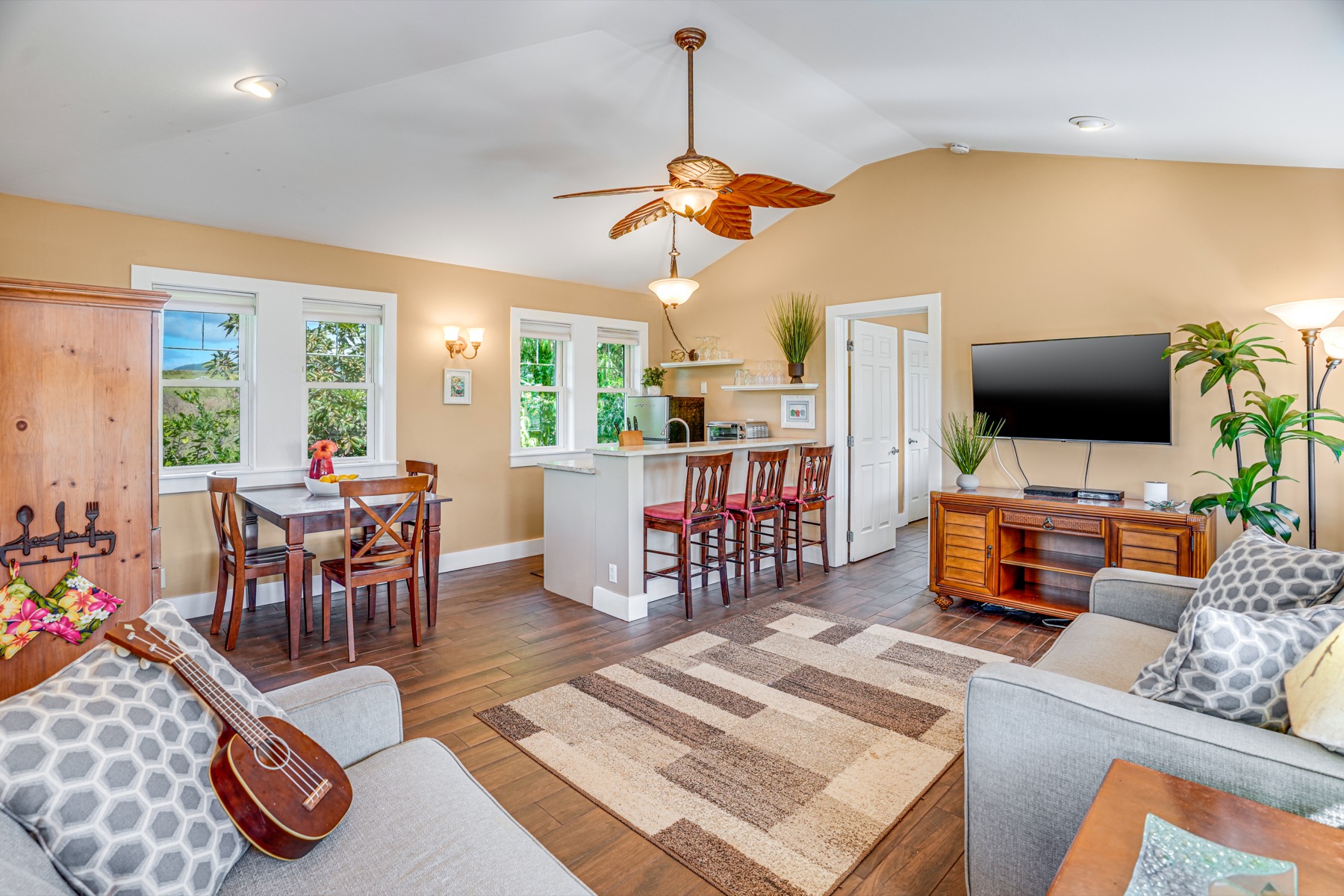 1730 Keleka Road Koloa, HI 96756 - Photo 23 of 29 a living room with furniture and a flat screen tv