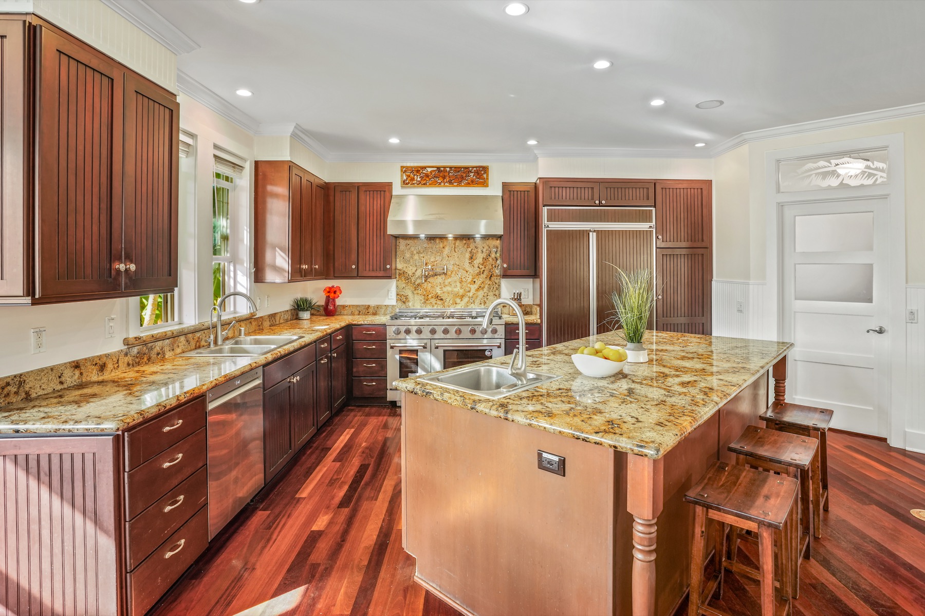1730 Keleka Road Koloa, HI 96756 - Photo 6 of 29 a kitchen with stainless steel appliances granite countertop wooden cabinets and sink