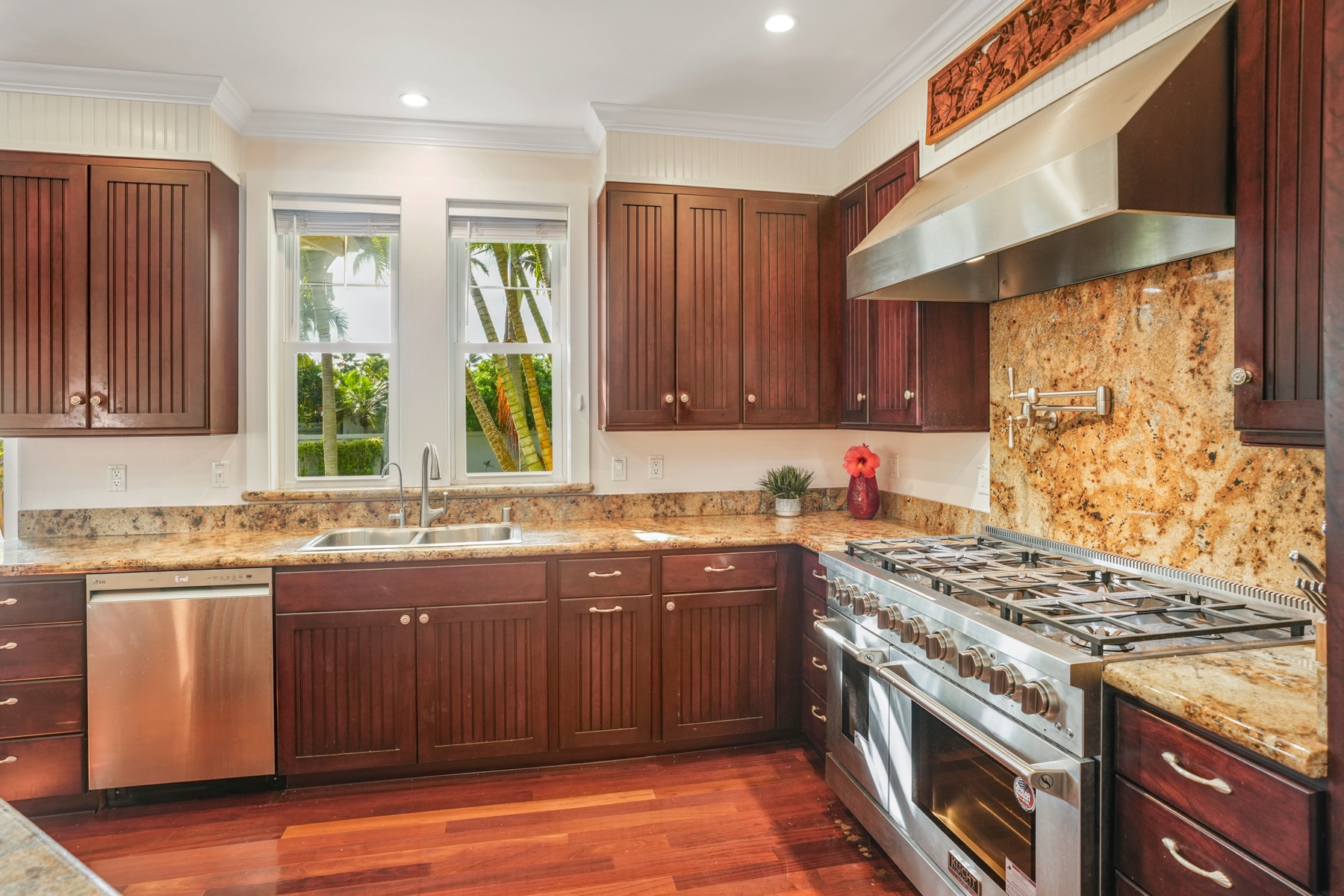 1730 Keleka Road Koloa, HI 96756 - Photo 7 of 29 a kitchen with stainless steel appliances granite countertop a stove a sink and a microwave
