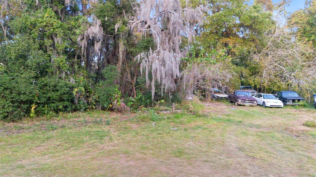 6159 Bagley Road Jacksonville, FL 32209 - Photo 13 of 17 a backyard of a house with table and chairs