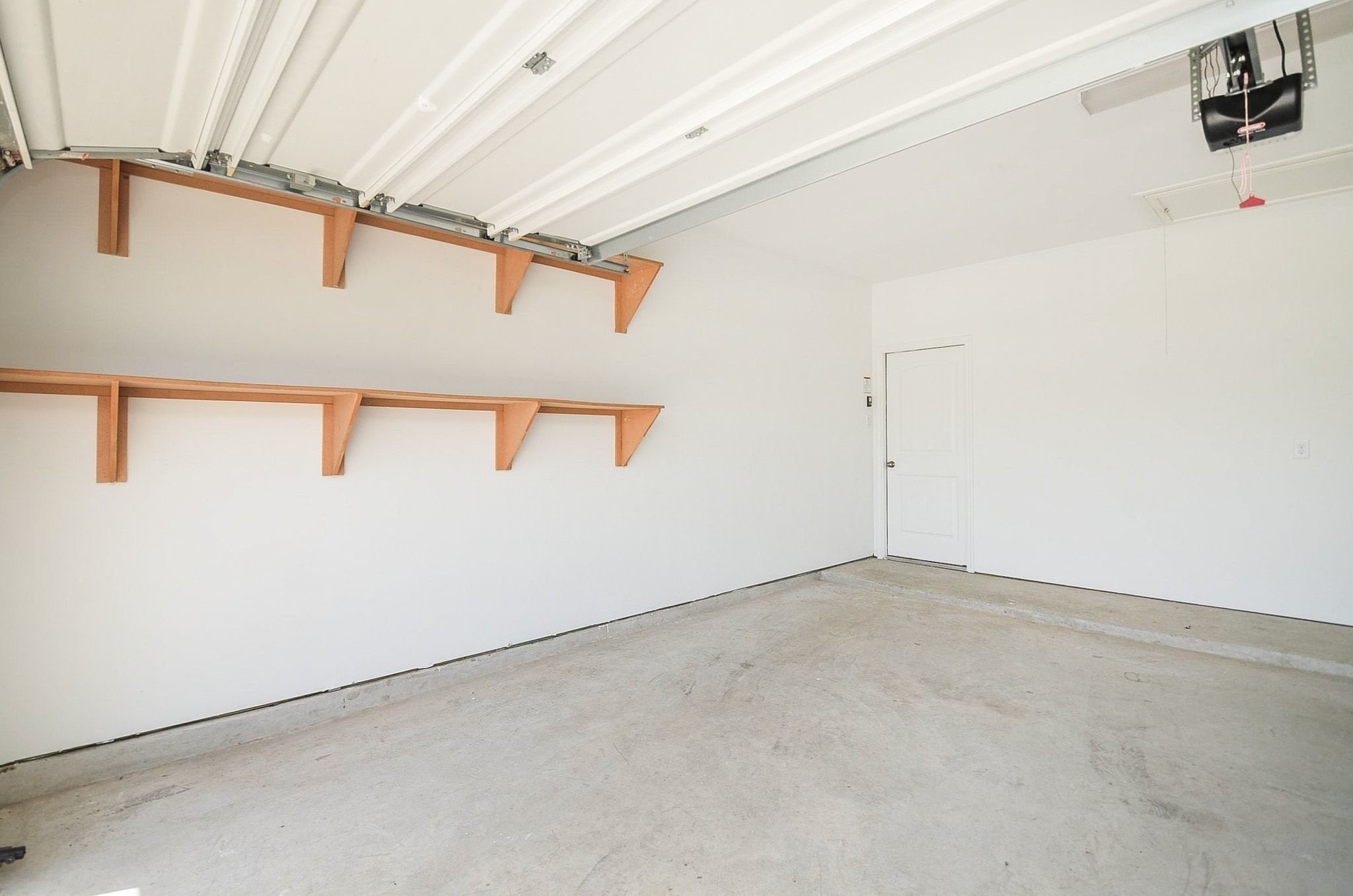 3820 Vista Grove Court Rosenberg, TX 77469 - Photo 36 of 36 Newly painted garage with new shelves
