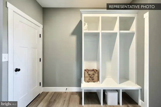 a dining room with furniture and a window