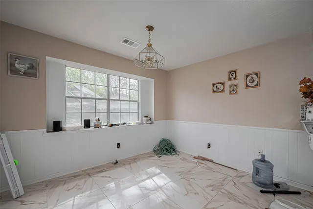 a kitchen with a refrigerator and a sink