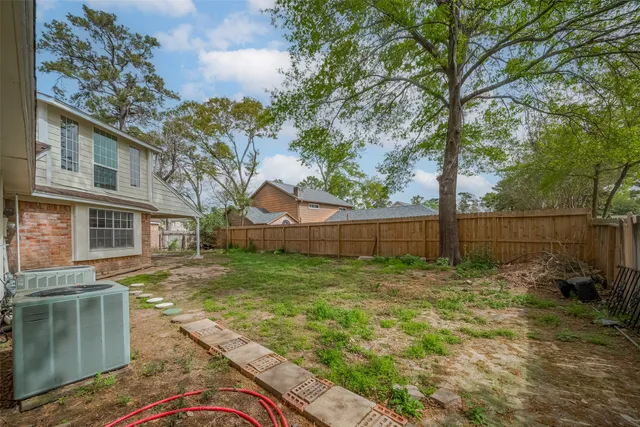 a view of house with outdoor space and garden