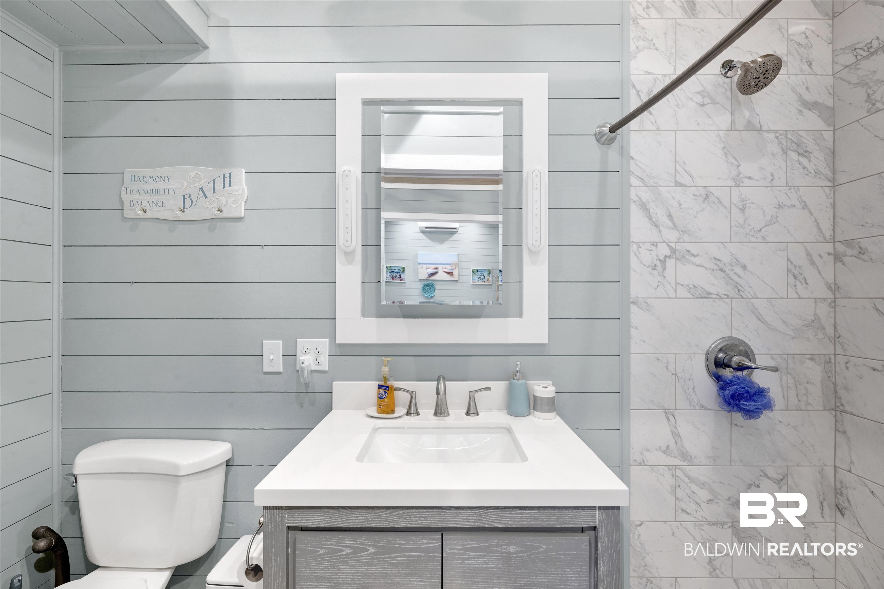 4650 Griffith Marina Road, Unit LOT 24 Orange Beach, AL 36561 - Photo 11 of 34 Bathroom featuring vanity, tiled shower, and wood walls